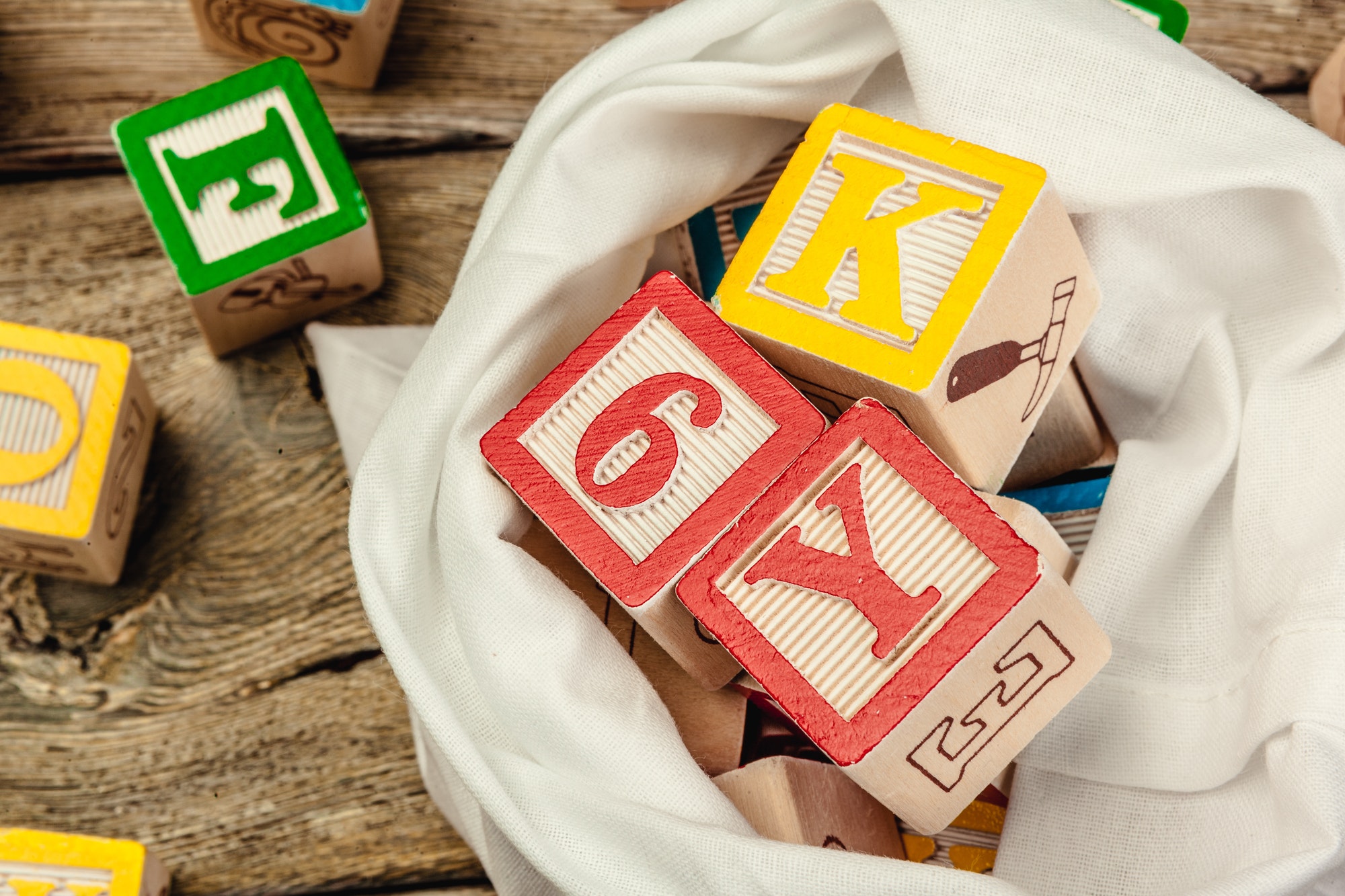 Letters background. Wooden cubes with letters on wooden background