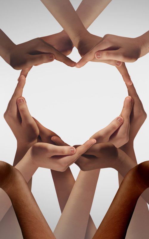 Unity And Togetherness Unity and Togetherness or diversity partnership as heart hands in a group of diverse people connected together shaped as a support symbol expressing the feeling of teamwork.