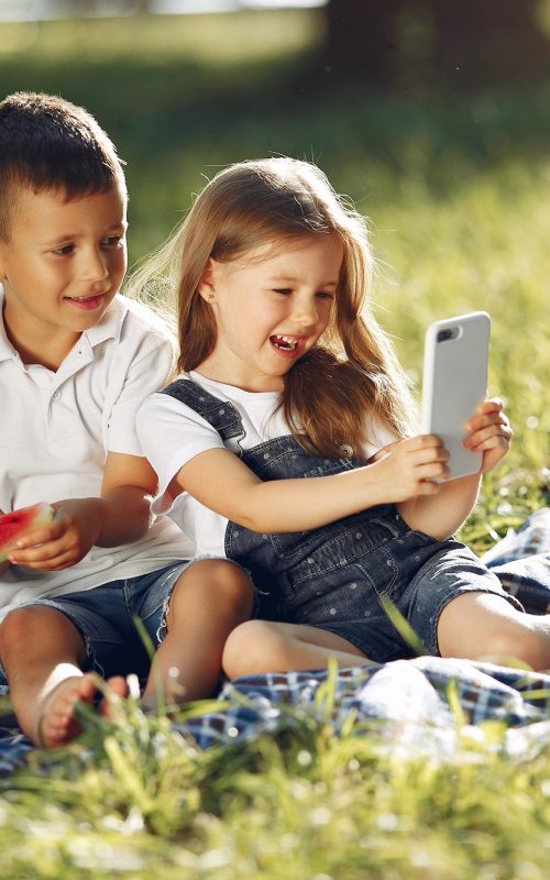 Cute children with watermelons in a park Cute children with watermelons in a park