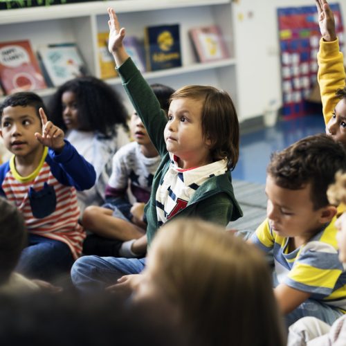 Kindergarten students sitting on the floor