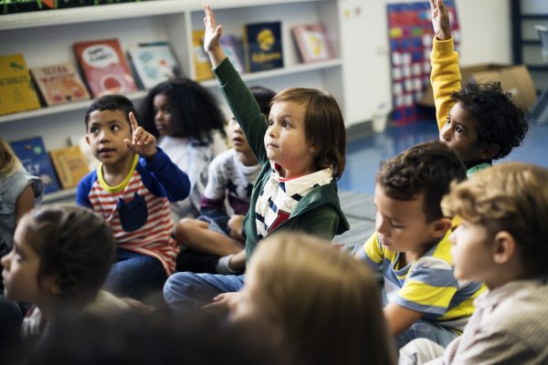 Kindergarten students sitting on the floor