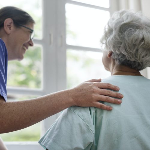 Nurse taking care of an old woman