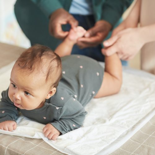 Parents Massaging Baby